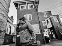 Navy veteran, Steve Viveiros, goes for a smoke outside of the Veterans Transition House in New Bedford after putting his laundry in the machine.  The VTH is currently located inside the former rectory of the St John the Baptist church on County Street in New Bedford which was the first Portuguese catholic church in the United States, and has been unoccupied since 2012.  Steve who has been living at the VTH for the last six months, is trying to get back on his feet, and has recently found a job working at a local hotel.  PHOTO PETER PEREIRA